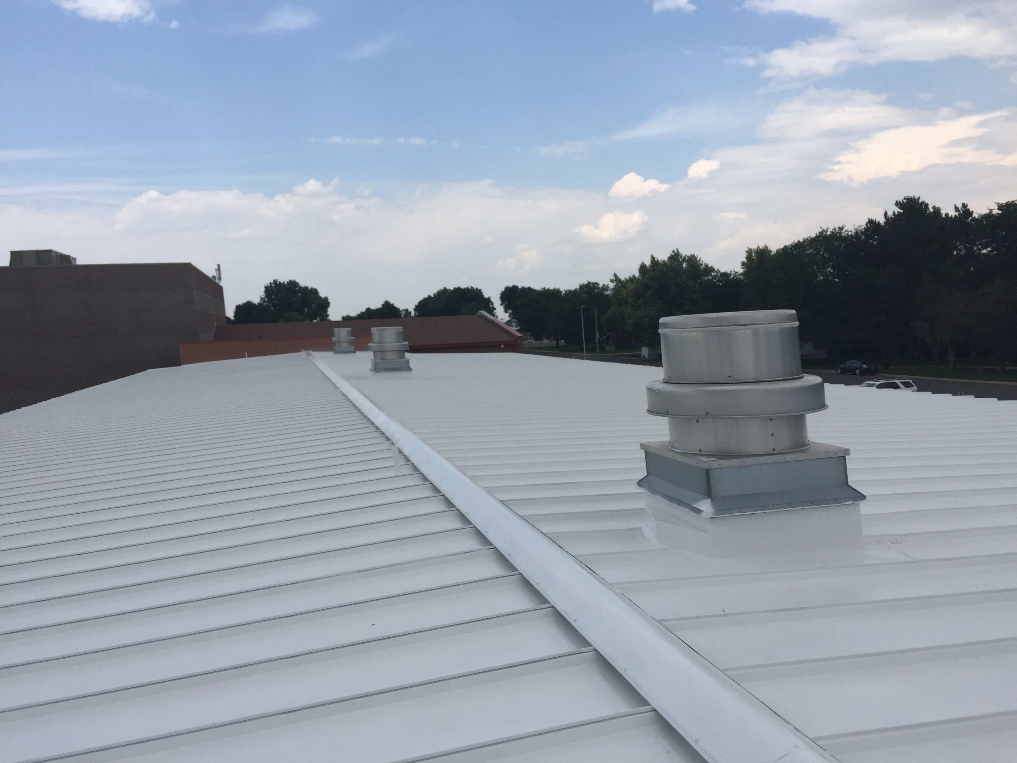Commercial roof restoration coating application in Central Missouri