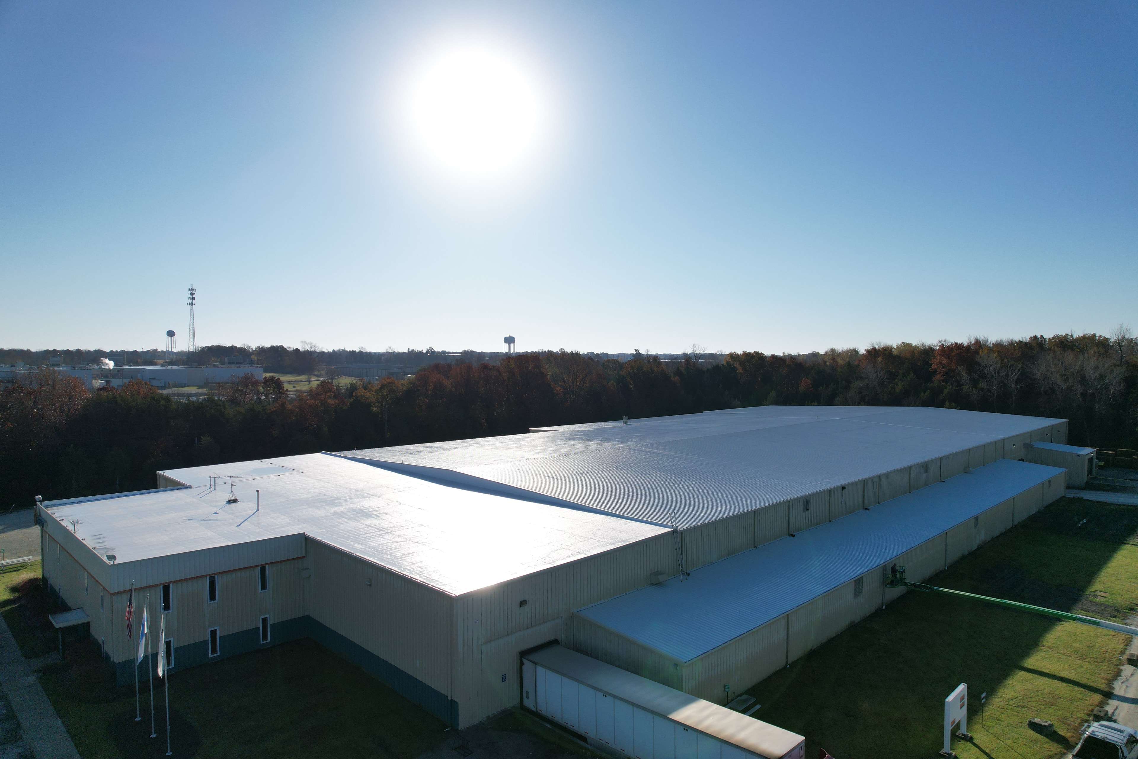 Commercial roof restoration coating application in Greater St. Louis